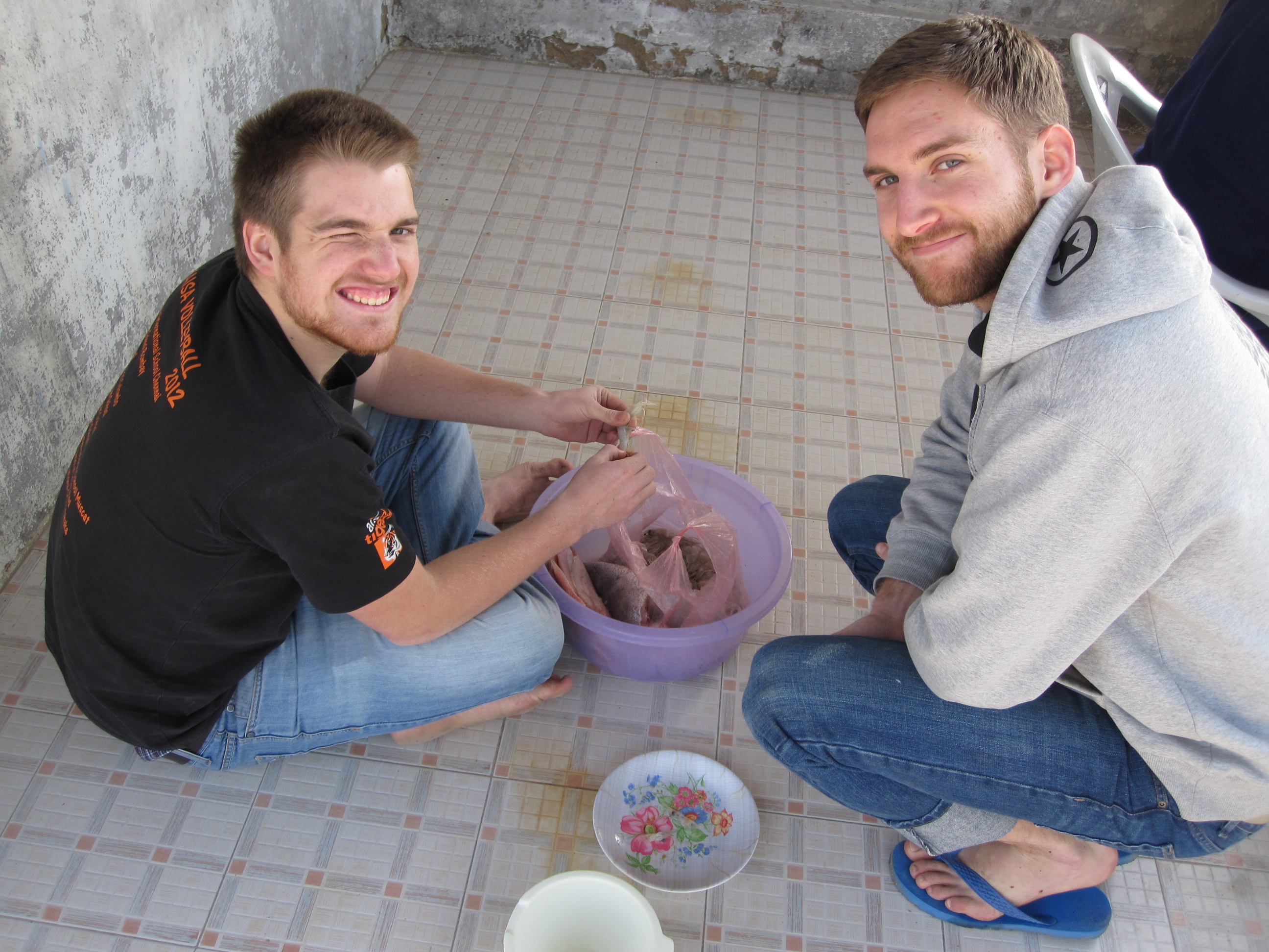 My brother, Stephen and I cleaning up the shrimp back at the hut